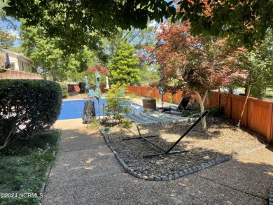 This waterfront resort home offers a lifestyle immersed in on Harbour Point Golf Club in North Carolina - for sale on GolfHomes.com, golf home, golf lot