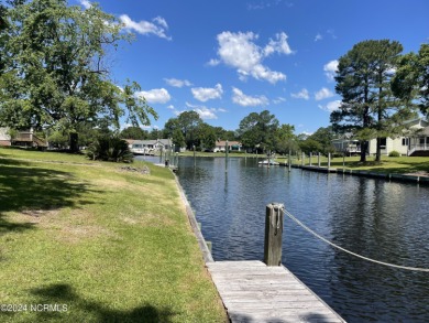 This waterfront resort home offers a lifestyle immersed in on Harbour Point Golf Club in North Carolina - for sale on GolfHomes.com, golf home, golf lot