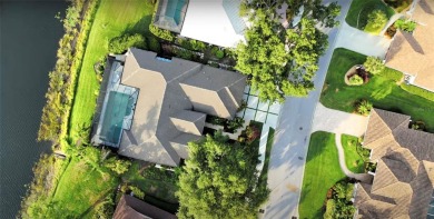 Reminiscent of On Golden Pond, this waterfront sanctuary will on TPC Prestancia in Florida - for sale on GolfHomes.com, golf home, golf lot