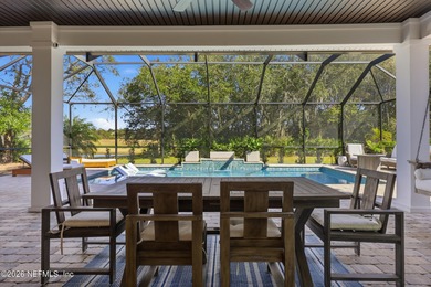 This former Cornerstone model home is situated on a private lot on The Palencia Club in Florida - for sale on GolfHomes.com, golf home, golf lot