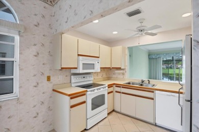Privacy is delivered in this 2 bedroom, 2 bathroom villa on The Meadows Golf and Country Club in Florida - for sale on GolfHomes.com, golf home, golf lot