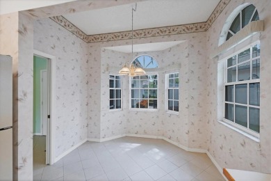 Privacy is delivered in this 2 bedroom, 2 bathroom villa on The Meadows Golf and Country Club in Florida - for sale on GolfHomes.com, golf home, golf lot