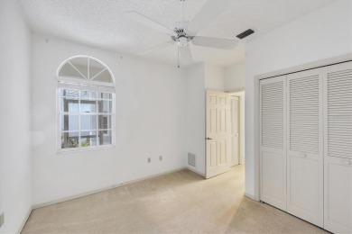Privacy is delivered in this 2 bedroom, 2 bathroom villa on The Meadows Golf and Country Club in Florida - for sale on GolfHomes.com, golf home, golf lot