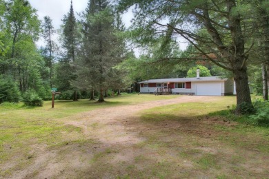 Explore a meticulously maintained 3-bedroom, 1.5-bathroom home on Plum Lake Golf Club in Wisconsin - for sale on GolfHomes.com, golf home, golf lot