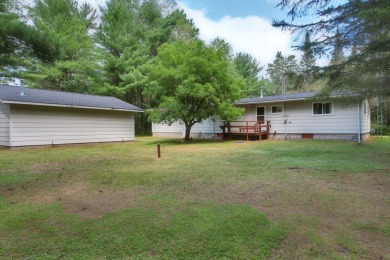 Explore a meticulously maintained 3-bedroom, 1.5-bathroom home on Plum Lake Golf Club in Wisconsin - for sale on GolfHomes.com, golf home, golf lot