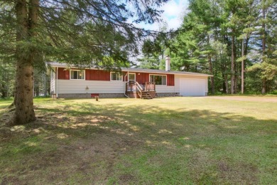 Explore a meticulously maintained 3-bedroom, 1.5-bathroom home on Plum Lake Golf Club in Wisconsin - for sale on GolfHomes.com, golf home, golf lot