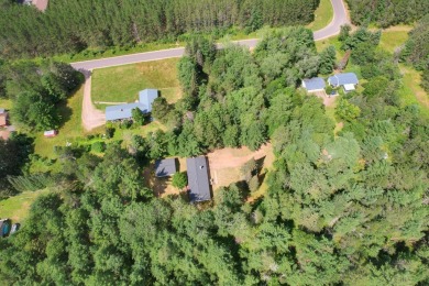 Explore a meticulously maintained 3-bedroom, 1.5-bathroom home on Plum Lake Golf Club in Wisconsin - for sale on GolfHomes.com, golf home, golf lot