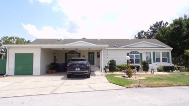 This charming three-bedroom Palm Harbor home offers an idyllic on Schalamar Creek Golf and Country Club in Florida - for sale on GolfHomes.com, golf home, golf lot