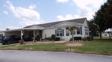 This charming three-bedroom Palm Harbor home offers an idyllic on Schalamar Creek Golf and Country Club in Florida - for sale on GolfHomes.com, golf home, golf lot