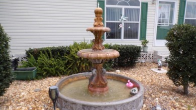 This charming three-bedroom Palm Harbor home offers an idyllic on Schalamar Creek Golf and Country Club in Florida - for sale on GolfHomes.com, golf home, golf lot