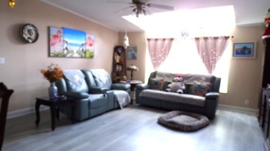 This charming three-bedroom Palm Harbor home offers an idyllic on Schalamar Creek Golf and Country Club in Florida - for sale on GolfHomes.com, golf home, golf lot