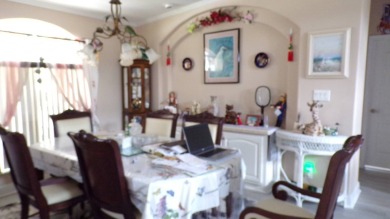 This charming three-bedroom Palm Harbor home offers an idyllic on Schalamar Creek Golf and Country Club in Florida - for sale on GolfHomes.com, golf home, golf lot
