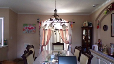 This charming three-bedroom Palm Harbor home offers an idyllic on Schalamar Creek Golf and Country Club in Florida - for sale on GolfHomes.com, golf home, golf lot