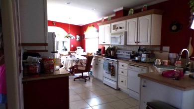 This charming three-bedroom Palm Harbor home offers an idyllic on Schalamar Creek Golf and Country Club in Florida - for sale on GolfHomes.com, golf home, golf lot