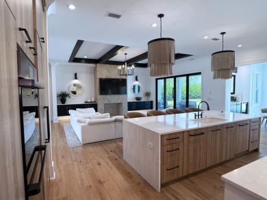 Experience refined coastal living at its finest in this on Camp Creek Golf Course in Florida - for sale on GolfHomes.com, golf home, golf lot