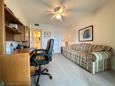 WATER VIEW! Indulge in this luxury 2 bed, 2 bath condo nestled on Hillsboro Pines Golf in Florida - for sale on GolfHomes.com, golf home, golf lot