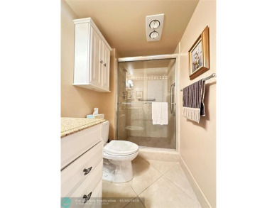 WATER VIEW! Indulge in this luxury 2 bed, 2 bath condo nestled on Hillsboro Pines Golf in Florida - for sale on GolfHomes.com, golf home, golf lot