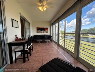 WATER VIEW! Indulge in this luxury 2 bed, 2 bath condo nestled on Hillsboro Pines Golf in Florida - for sale on GolfHomes.com, golf home, golf lot