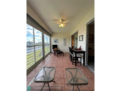 WATER VIEW! Indulge in this luxury 2 bed, 2 bath condo nestled on Hillsboro Pines Golf in Florida - for sale on GolfHomes.com, golf home, golf lot