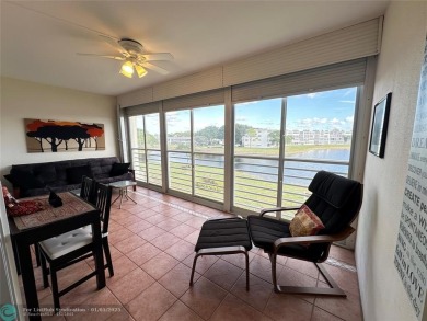 WATER VIEW! Indulge in this luxury 2 bed, 2 bath condo nestled on Hillsboro Pines Golf in Florida - for sale on GolfHomes.com, golf home, golf lot