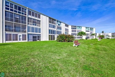 WATER VIEW! Indulge in this luxury 2 bed, 2 bath condo nestled on Hillsboro Pines Golf in Florida - for sale on GolfHomes.com, golf home, golf lot