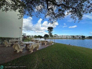 WATER VIEW! Indulge in this luxury 2 bed, 2 bath condo nestled on Hillsboro Pines Golf in Florida - for sale on GolfHomes.com, golf home, golf lot