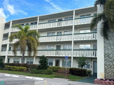 WATER VIEW! Indulge in this luxury 2 bed, 2 bath condo nestled on Hillsboro Pines Golf in Florida - for sale on GolfHomes.com, golf home, golf lot