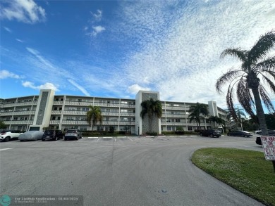 WATER VIEW! Indulge in this luxury 2 bed, 2 bath condo nestled on Hillsboro Pines Golf in Florida - for sale on GolfHomes.com, golf home, golf lot