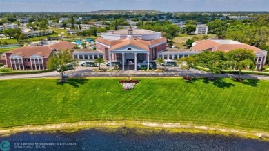 WATER VIEW! Indulge in this luxury 2 bed, 2 bath condo nestled on Hillsboro Pines Golf in Florida - for sale on GolfHomes.com, golf home, golf lot