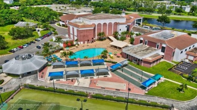 WATER VIEW! Indulge in this luxury 2 bed, 2 bath condo nestled on Hillsboro Pines Golf in Florida - for sale on GolfHomes.com, golf home, golf lot