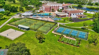 WATER VIEW! Indulge in this luxury 2 bed, 2 bath condo nestled on Hillsboro Pines Golf in Florida - for sale on GolfHomes.com, golf home, golf lot