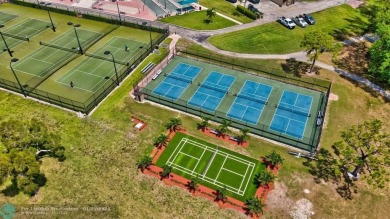 WATER VIEW! Indulge in this luxury 2 bed, 2 bath condo nestled on Hillsboro Pines Golf in Florida - for sale on GolfHomes.com, golf home, golf lot