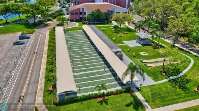 WATER VIEW! Indulge in this luxury 2 bed, 2 bath condo nestled on Hillsboro Pines Golf in Florida - for sale on GolfHomes.com, golf home, golf lot