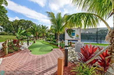 WATER VIEW! Indulge in this luxury 2 bed, 2 bath condo nestled on Hillsboro Pines Golf in Florida - for sale on GolfHomes.com, golf home, golf lot