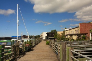 Check out this spacious three bed and two full bath condo in on Wedgefield Plantation Golf Club in South Carolina - for sale on GolfHomes.com, golf home, golf lot