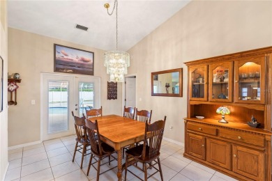 Welcome to this beautifully maintained 3 bedroom, 2 bath pool on The Grand Club Cypress Course in Florida - for sale on GolfHomes.com, golf home, golf lot