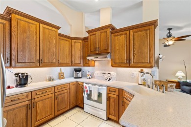 Welcome to this beautifully maintained 3 bedroom, 2 bath pool on The Grand Club Cypress Course in Florida - for sale on GolfHomes.com, golf home, golf lot