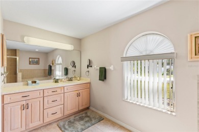 Welcome to this beautifully maintained 3 bedroom, 2 bath pool on The Grand Club Cypress Course in Florida - for sale on GolfHomes.com, golf home, golf lot