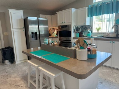Experience luxury living in this stunning 1760 sq ft on Four Lakes Golf Club in Florida - for sale on GolfHomes.com, golf home, golf lot