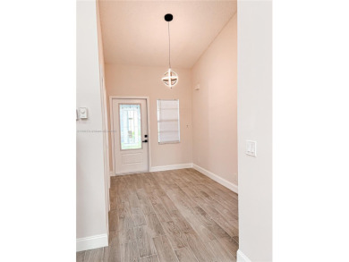 Welcome to your Florida oasis! This fully renovated and spacious on Cypress Lakes Golf Course - West Palm Beach in Florida - for sale on GolfHomes.com, golf home, golf lot