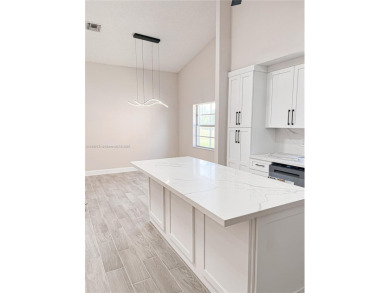 Welcome to your Florida oasis! This fully renovated and spacious on Cypress Lakes Golf Course - West Palm Beach in Florida - for sale on GolfHomes.com, golf home, golf lot