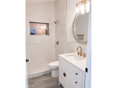 Welcome to your Florida oasis! This fully renovated and spacious on Cypress Lakes Golf Course - West Palm Beach in Florida - for sale on GolfHomes.com, golf home, golf lot