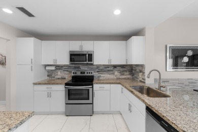 This lovely home overlooking the lake has been upgraded from on Boca Delray Golf and Country Club in Florida - for sale on GolfHomes.com, golf home, golf lot