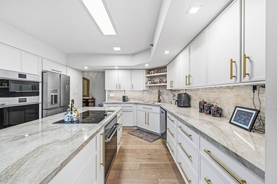 Located in a quiet gated enclave within Boca Pointe on Boca Pointe Country Club in Florida - for sale on GolfHomes.com, golf home, golf lot