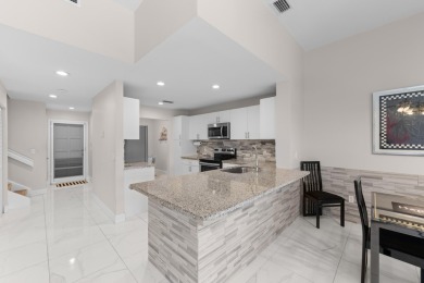 This lovely home overlooking the lake has been upgraded from on Boca Delray Golf and Country Club in Florida - for sale on GolfHomes.com, golf home, golf lot