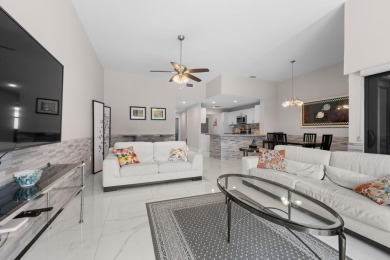This lovely home overlooking the lake has been upgraded from on Boca Delray Golf and Country Club in Florida - for sale on GolfHomes.com, golf home, golf lot