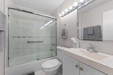 This lovely home overlooking the lake has been upgraded from on Boca Delray Golf and Country Club in Florida - for sale on GolfHomes.com, golf home, golf lot