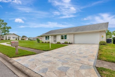 Stunning 2/2 home with a 2-car garage in a vibrant 55+ community on Highland Lakes Executive Golf Course in Florida - for sale on GolfHomes.com, golf home, golf lot