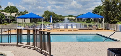 This lovely home overlooking the lake has been upgraded from on Boca Delray Golf and Country Club in Florida - for sale on GolfHomes.com, golf home, golf lot