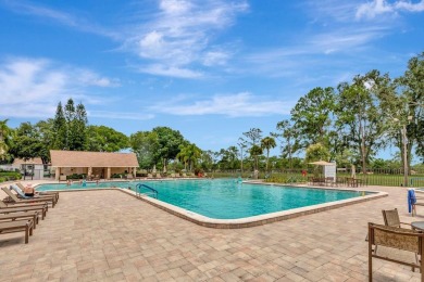 Stunning 2/2 home with a 2-car garage in a vibrant 55+ community on Highland Lakes Executive Golf Course in Florida - for sale on GolfHomes.com, golf home, golf lot